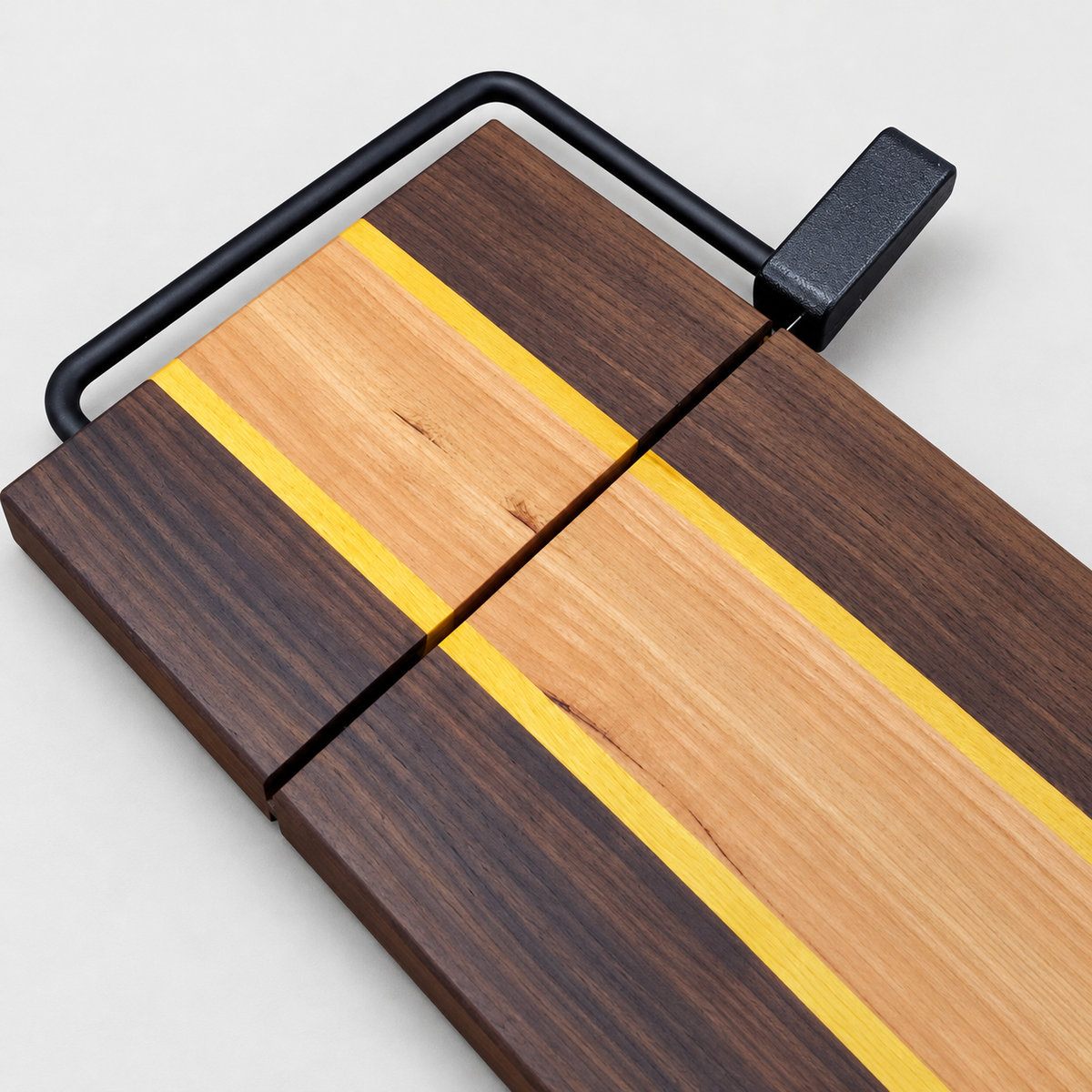 Cheese Slicer With Maple, Walnut and Yellowheart Wood, detail view on a light gray background