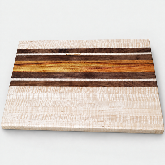 Handcrafted Curly Maple Cutting Board – 19 x 12 on a light gray background