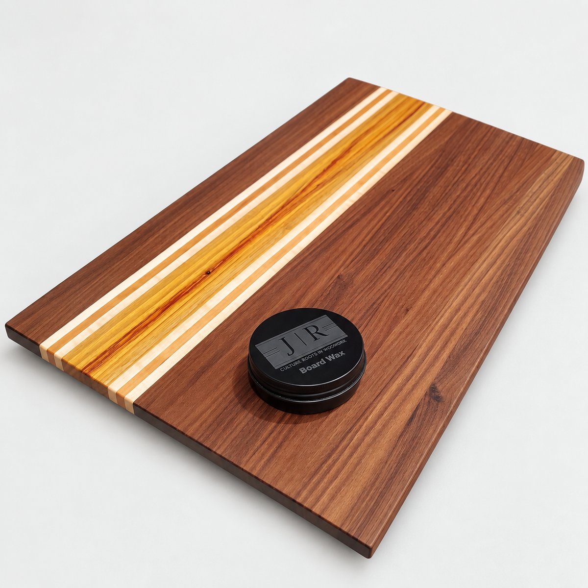 Handcrafted Walnut & Canary Wood Cutting Board – 19 x 12, detail view on a light gray background