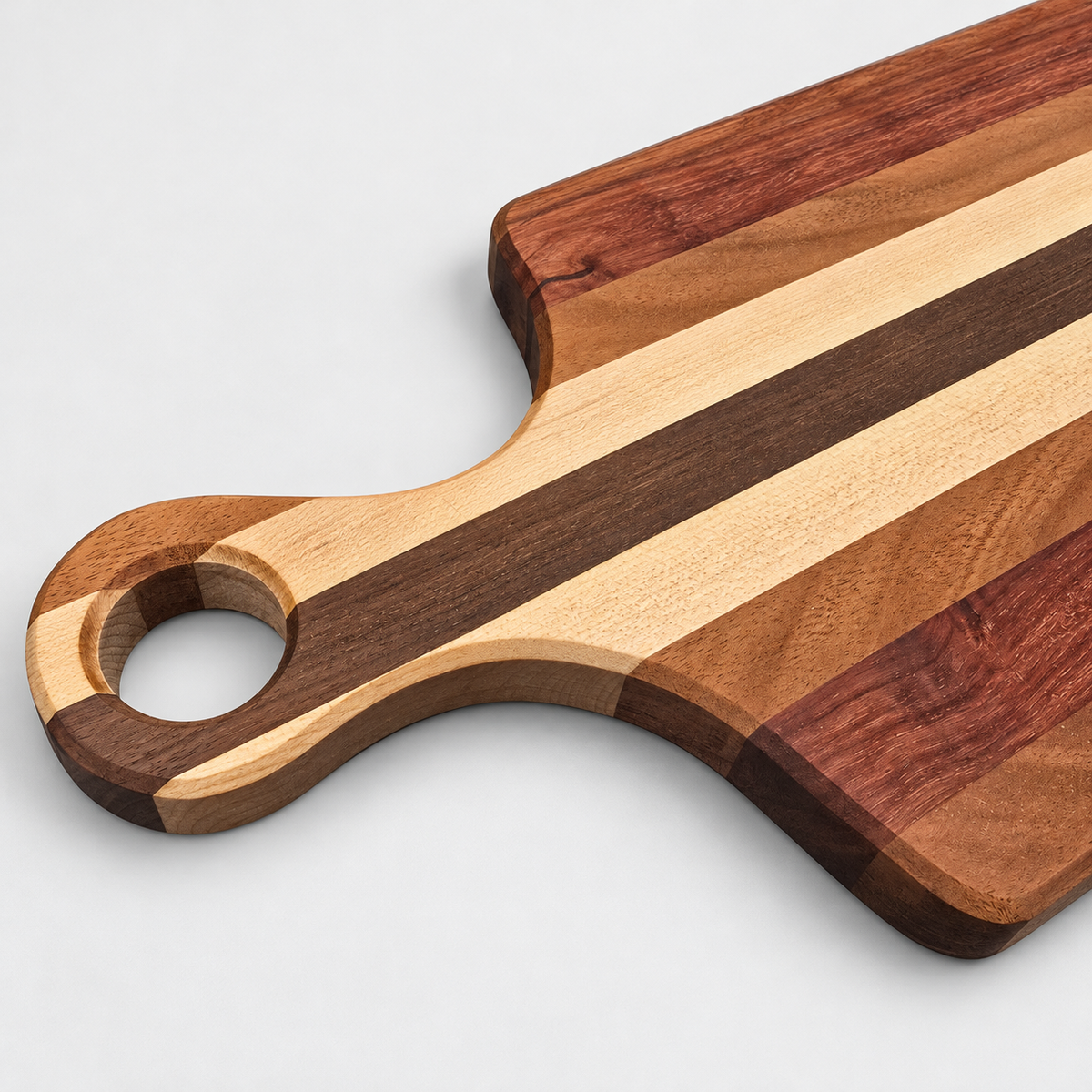 Handcrafted Charcuterie Board – Walnut, Maple, Sapele, and Padauk, detail view on a light gray background