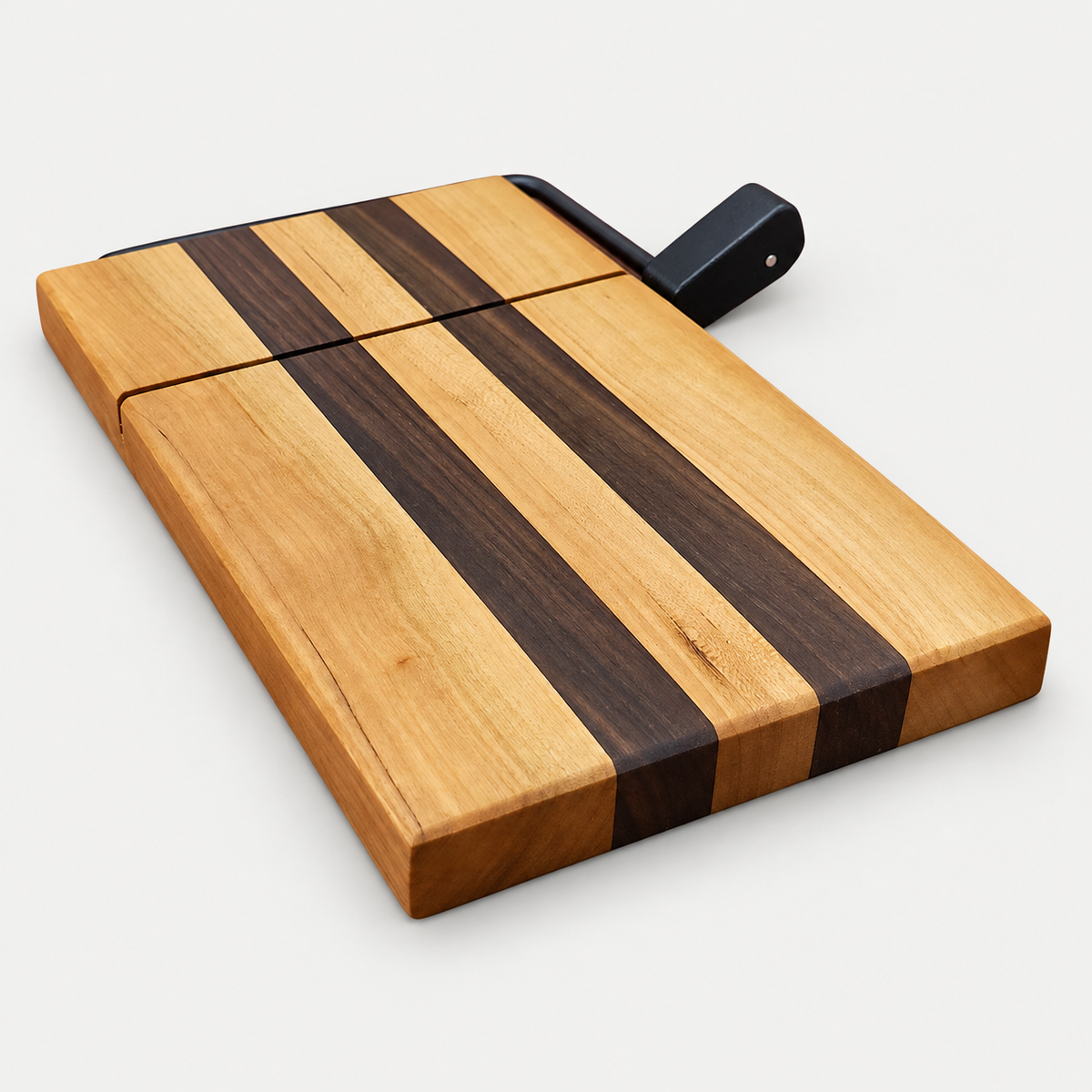 Walnut and Maple cheese slicer, detail view on a light gray background