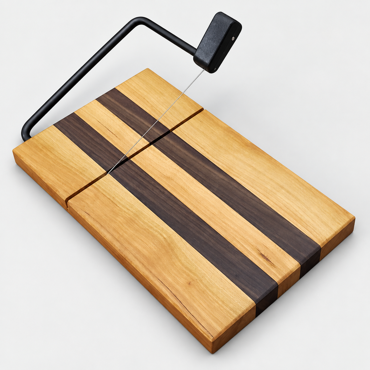 Walnut and Maple cheese slicer on a light gray background