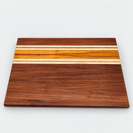 Handcrafted Walnut & Canary Wood Cutting Board – 19 x 12 on a light gray background