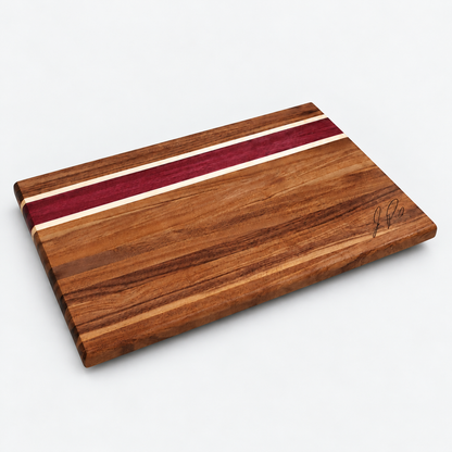 Walnut and purpleheart cutting board centered on a light gray background