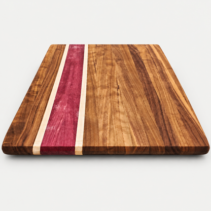 Walnut and purpleheart cutting board, detail view 2, on a light gray background